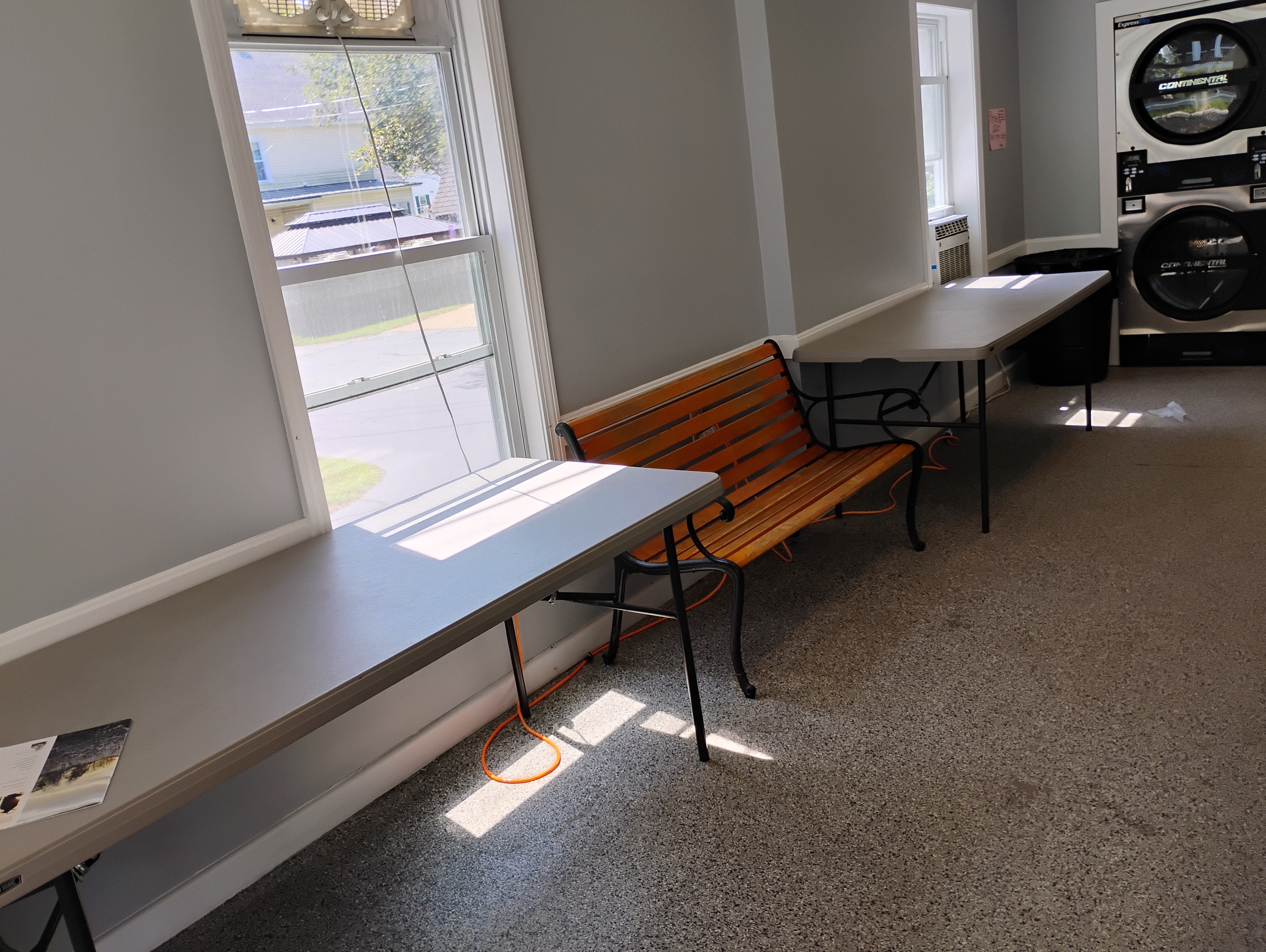 Seating and folding area inside Penacook Village Express Laundry Center
