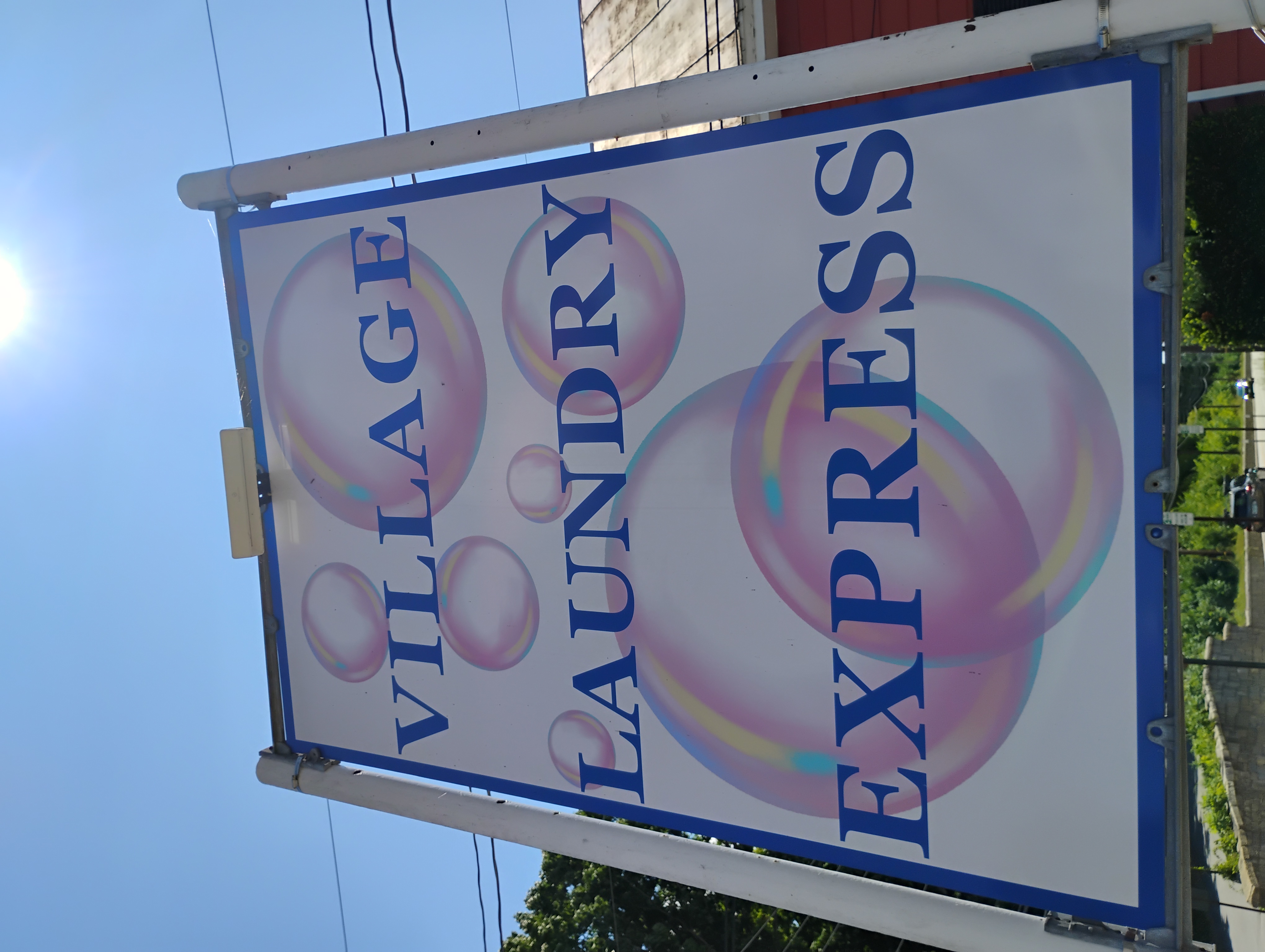 Village Laundry Express sign
